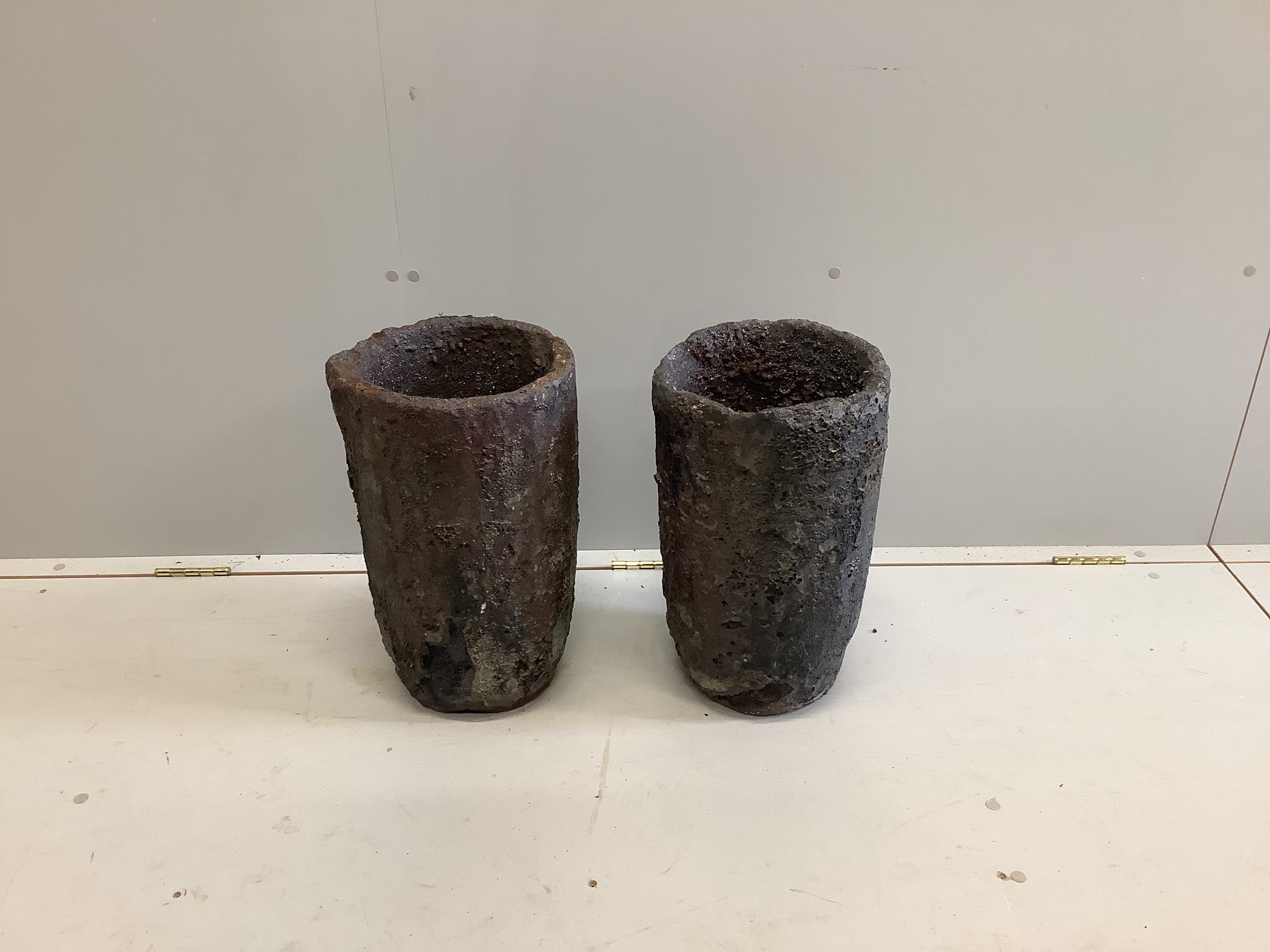 A pair of French Slag Foundry pots, diameter 26cm, height 45cm